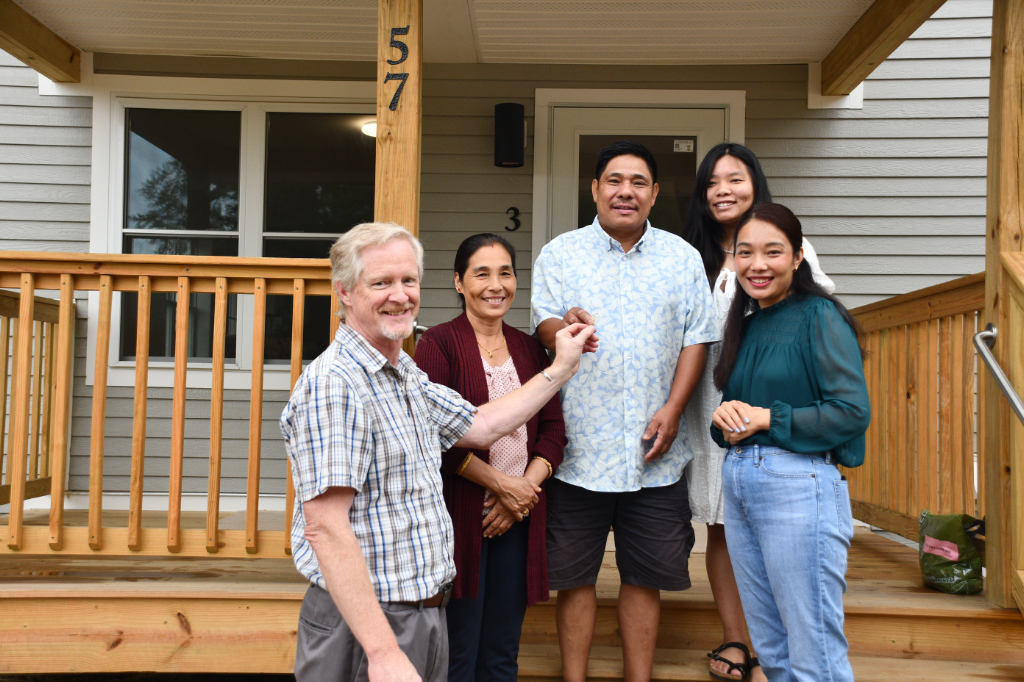 A Habitat family getting the keys to their new home