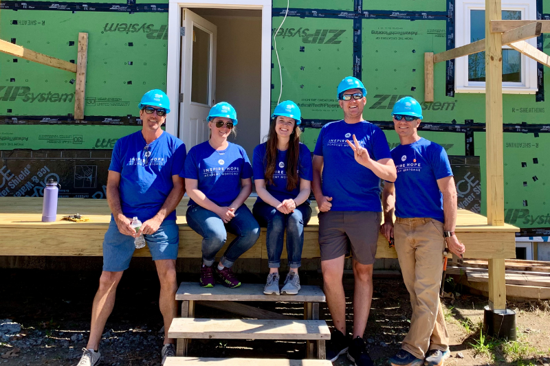 A group of Academy Mortgage volunteers posing for a photo during their Team Build day