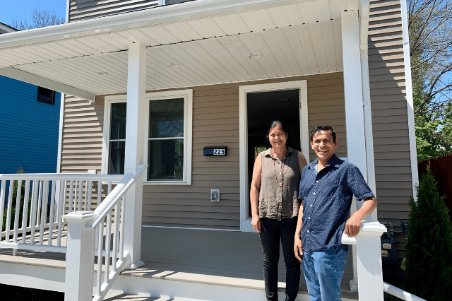 A Habitat family on the porch of their new affordable home