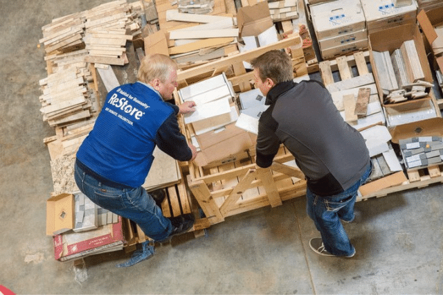 A Habitat ReStore volunteer helping a store customer