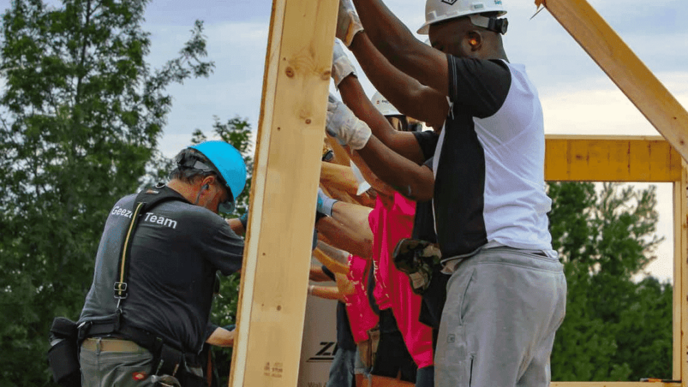 Habitat volunteers raising a wall in Milton, Vermont