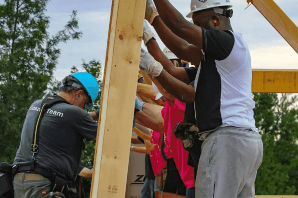 Habitat volunteers raising a wall in Milton, Vermont